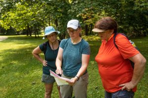 female hikers learning map reading skills